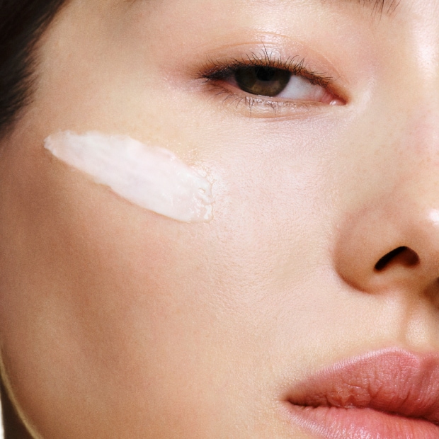 Model removing makeup with our gentle yet powerful Soothing Cleansing Oil